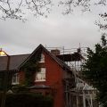 Scaffolding erected around chimney stack.