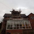 Scaffolding erected around chimney stack.