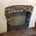 Fireplace brick arch reinstated.